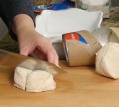 a person is cutting up some food on a table