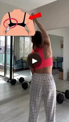 a woman is doing exercises in the living room with an exercise board on her head