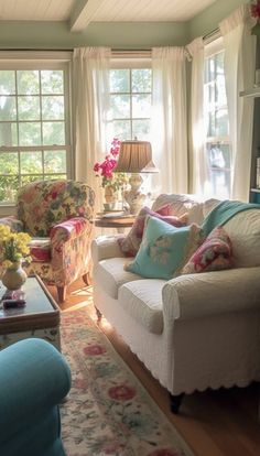 a living room filled with lots of furniture and flowers in vases on the windowsill