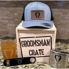 the groomsman crate includes a hip flask, two shot glasses and a bottle opener