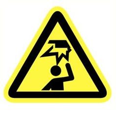 a yellow and black warning sign with an image of a man holding a lightning bolt