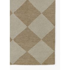 a beige and white rug with an argyle pattern on the bottom, in front of a white background