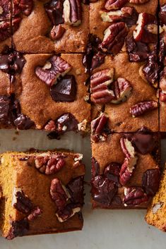 several slices of cake with nuts and chocolate toppings on top, cut into squares