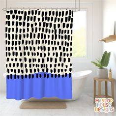 a blue and white shower curtain with black dots on it in front of a bathtub