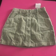 Woman’s Corduroy Skirt (New ) Size Small Green With Buttons Down The Middle Cute Cotton Skirt For Fall, Corduroy Mini Bottoms For Spring, Trendy Corduroy Skirt For Spring, Trendy Mini Length Corduroy Bottoms, Casual Corduroy Skirt For Spring, Forever 21 Cotton Skort For Spring, Casual Forever 21 Skirt For Fall, Casual Cotton Skort From Forever 21, Spring Cotton Skort From Forever 21