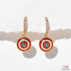 With our Marvel's Captain America Hoops, you can add some Super Hero style to your everyday look. The hoops feature Captain America's iconic shield, with vibrant red, white, and blue enamel detailing that's sure to make a statement. The glimmering stones that line the hoops add an extra level of chicness, making these Captain America Jewelry, Wonder Woman Jewelry, Black Panther Necklace, Marvel Jewelry, Doctor Strange Marvel, Dinosaur Earrings, Marvel Merchandise, Hulk Marvel, Flat Back Earrings