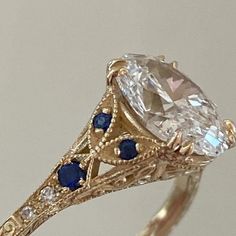 an antique diamond and blue sapphire engagement ring