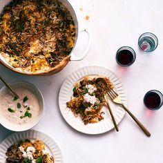 three plates of food on a marble table