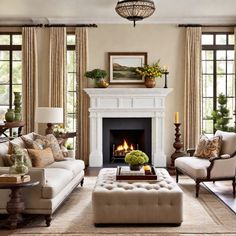 a living room with couches, chairs and a fire place in the fireplace area