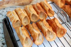 several pieces of bread sitting on top of a metal rack