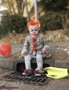 a creepy doll sitting on top of a grate