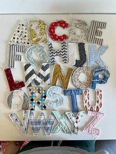 the letters are made out of fabric and sewn together