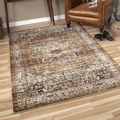 a brown chair sitting on top of a wooden floor