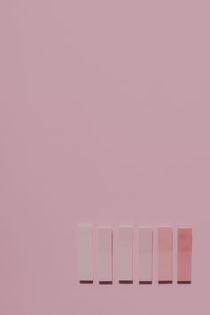 four different shades of pink and white against a light pink background with the word love spelled in small rectangles