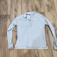 New Grey Nike Running Shirt. Zippered Pullover Features Sleeves That Can Be Pulled Over Your Hand To Keep You Warm. Nike Gray Tops For Fall, Nike Gray Stretch Top, Silver Long Sleeve Tops For Fall, Nike Running Shirt, Clothing Finds, Running Shirts, Grey Nikes, Womens Casual, Womens Casual Outfits