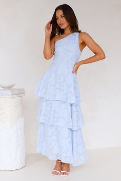 Length from bust to hem of size S: 130cm. Chest: 37cm, Waist: 31cm, across front only of size S. Maxi dress. Semi-lined. Model is a standard XS and is wearing size XS. True to size. Non-stretch. One shoulder. Tiered frill design. Flowy skirt. Elastic back. Textured fabrication. Zipper. Cold hand wash only. Polyester/Spandex. Designed for fancy events. The Harley One Shoulder Maxi Dress features a gorgeous tiered frill skirt and an elastic back for the perfect fit. Style with heels and curls. Cute Dresses For Dinner, Winter Ball Dresses High School, Light Blue Ruffle Dress, Cocktail Wedding Guest Dress, Elegant Blue Dress, Baby Blue Bridesmaid Dresses, Light Blue Maxi Dress, Light Blue Bridesmaid Dresses, Maxi Prom Dress