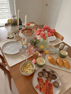 the table is set with many different types of food