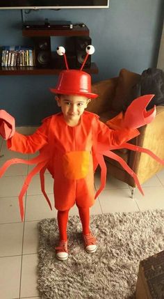 a little boy dressed up as a lobster