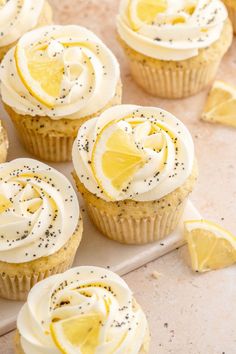 lemon cupcakes with cream cheese frosting and sprinkles on top