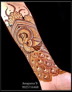 henna tattoo designs on the arm and hand