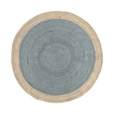 a blue and beige rug on a white background with an oval design in the center