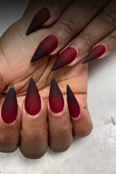 Get a stylish edgy twist with these stunning red & black almond nails. This unique nail design is perfect for making a bold statement and adding some attitude to your look. Whether you’re going for a night out or just want to express your individuality, these nails will definitely turn heads. The combination of the vibrant red and sleek black colors creates a striking contrast that is sure to make you stand out. Elevate your manicure game with these fierce and sophisticated almond nails today! Red And Black Witch Nails, Red To Black Nails Ombre, Blood Tipped Nails, Red Oval Nails Designs, Hades And Persephone Inspired Nails, Black And Red Nails Design Ideas, Gel Nail Color Combinations, Fall Nails Spooky, October Stilleto Nails