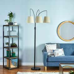 The allen + roth floor lamp is a perfect addition to add light over a chair for reading or any task. Its casual three arc design supports three hanging fabric shades and the heavy round metal base holds the lamp securely in place. allen + roth 80-in Bronze Multi-head Floor Lamp | FL05BZ Chair For Reading, Arc Design, Hanging Fabric, Allen Roth, Arc Floor Lamps, Kit Homes, A Chair, Floor Lamps, Fabric Shades