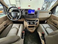 the interior of a vehicle with leather seats