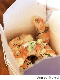 a box filled with food sitting on top of a wooden table