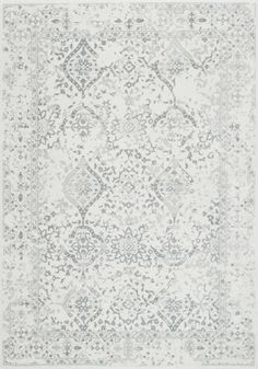 a white rug with blue and grey designs on it