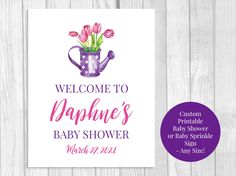 a baby shower sign with tulips in a watering can and the words welcome to nappine's baby shower