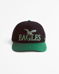 the eagles hat is black and green with an eagle on it's front side