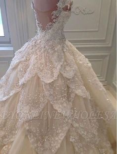 a ball gown with white flowers on it