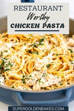 chicken pasta in a skillet with parmesan cheese on top