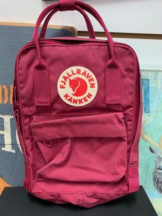 Fjallraven Kanken Mini Backpack for Everyday Used. (Like new, Great condition, only wore 1or 2 times)  See pictures for the details.  All Items are 100% Authentic. Please look at all pictures carefully. The pictures shown above are the exaction you will be receiving. Buy with Confidence!! COLOR: RED ONESIZE Measures 10" x 7.9" x 3.9" Fjallraven Kanken Mini, Kanken Mini, Unisex Backpack, Fjallraven Kanken, Mini Backpack, The Details, Picture Show, Bags Handbags, Shoe Accessories