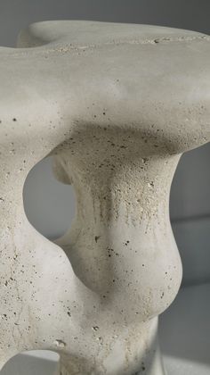 a white sculpture sitting on top of a table