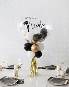 Bring a fun touch to your graduation with our graduation bubble centerpiece! Complete with mini balloons and tassel skirt, this bring plenty of festive flair to their big celebration. Centerpieces For Awards Ceremony, Graduation Dinner Centerpiece Ideas, Highschool Graduation Party Decorations, Masculine Balloon Decor, Law School Graduation Party Centerpieces, Graduation Decorations Balloons, Graduation Dinner Decorations, Centerpieces For Sports Banquet, Single Balloon Centerpiece