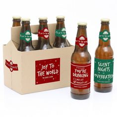 six bottles of beer in a cardboard box on a white background with the words, you're the world