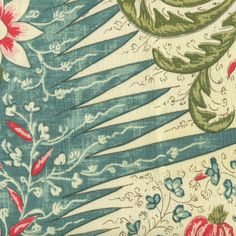 an old wallpaper with flowers and leaves on blue background, closeup view from the neck down