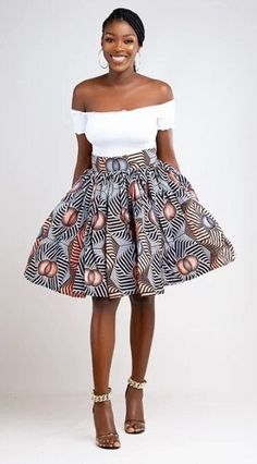 Celebrate with this lovely skirt. Carefully finished with a waist band and attached belt for an enhanced fit, The Gina A line skirt is the ideal go to piece. The mini length allows you to pair it with heels or flats, making this skirt the perfect choice for work  or a day out. Description 100% Cotton African Print Wax  Back invisible zipper  Fully lined for added comfort  2.5 inches waist band Medium Length of top is 26 inches Made in Cameroon Fabric from Benin Care instructions Hand wash cold H Relaxed Fit Belted Flared Skirt, Fitted Belted Pleated Skirt, Belted Fitted Pleated Skirt, Lined Mini Wrap Skirt, Fitted Belted Wrap Skirt, Spring Fitted Belted Skirt, Belted Relaxed Midi Skirt, Relaxed Fit Belted Pleated Skirt, Chic Ruffled Full Mini Skirt