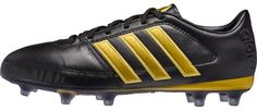 the adidas soccer shoe is black with gold trimmings and two tone detailing