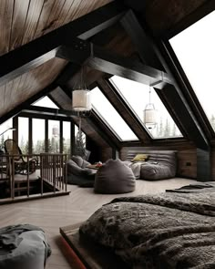 an attic bedroom with wooden floors and vaulted ceiling, filled with windows to let in natural light