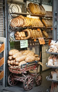 breads and pastries on display in a bakery