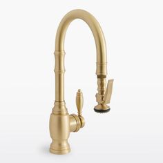 a golden faucet on a white background with the handle extended to it's side