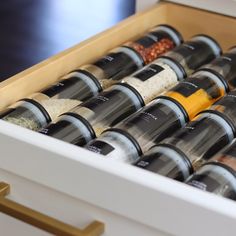 an open drawer with spices and seasonings in it