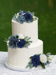 Navy Blue Cake Topper Flowers Set White Wedding Cake With Dusty Blue Flowers, Diy Navy Blue Wedding Decor, Wedding Cake Ideas Navy Blue, Classic Blue Wedding Cake, Navy Blue Cake Wedding, Wedding Cake Dusty Blue Flowers, Navy And Dusty Blue Wedding Cake, Dusty Blue 2 Tier Wedding Cake, Wedding Cake With Fake Flowers