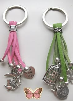 two key chains with charms attached to them