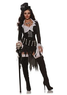 a woman dressed in a skeleton costume and holding a cane with her left arm out