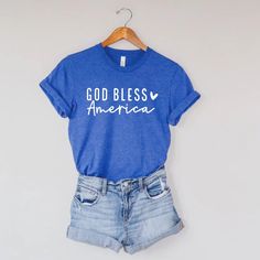 God Bless America Graphic Canvas T-Shirt Basic Blue Tops With Text Print, God Bless America, Diy Shirt, Cricut Ideas, July 4th, God Bless, Shirt Outfit, Cool Shirts, Bella Canvas