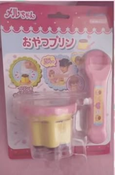 a pink and yellow toy set in its package